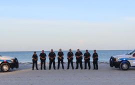 Police Officers and Police Vehicles on Beach