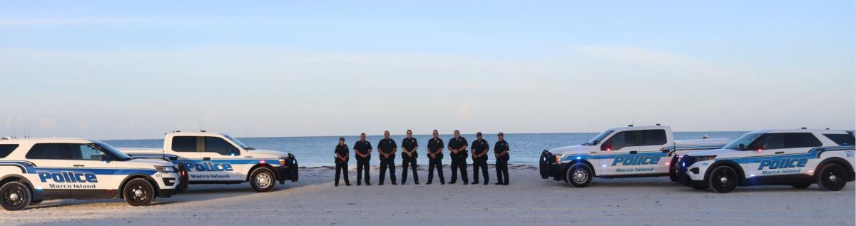 Police Officers and Police Vehicles on Beach
